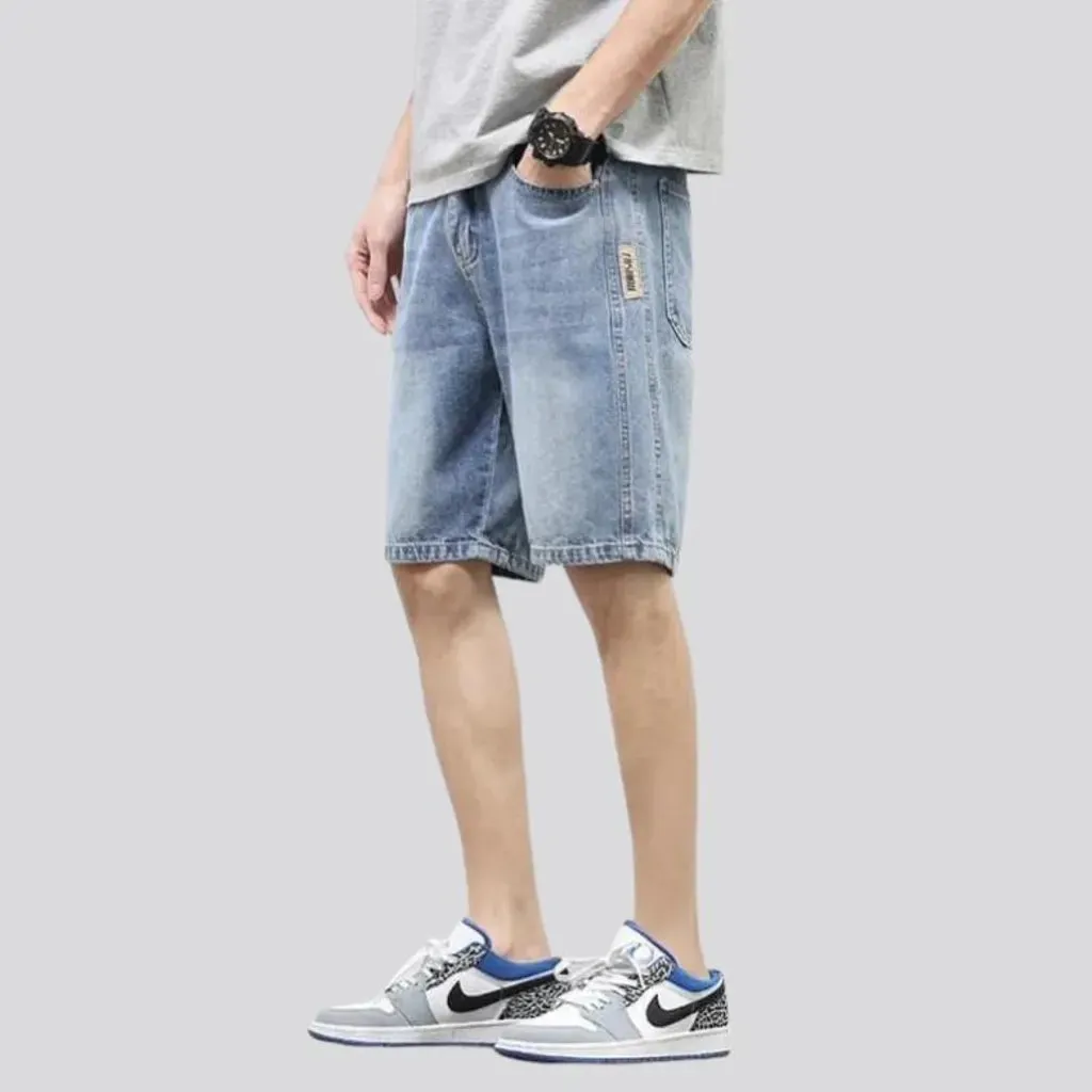 Sanded knee-length jeans shorts